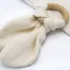 Babyjem Ahşap Diş Kaşıyıcılı Bürümcük Müslin Önlük Ekru